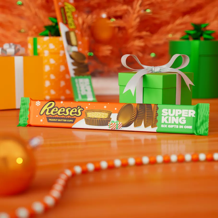 pack of reeses milk chocolate super king peanut butter cups under christmas tree