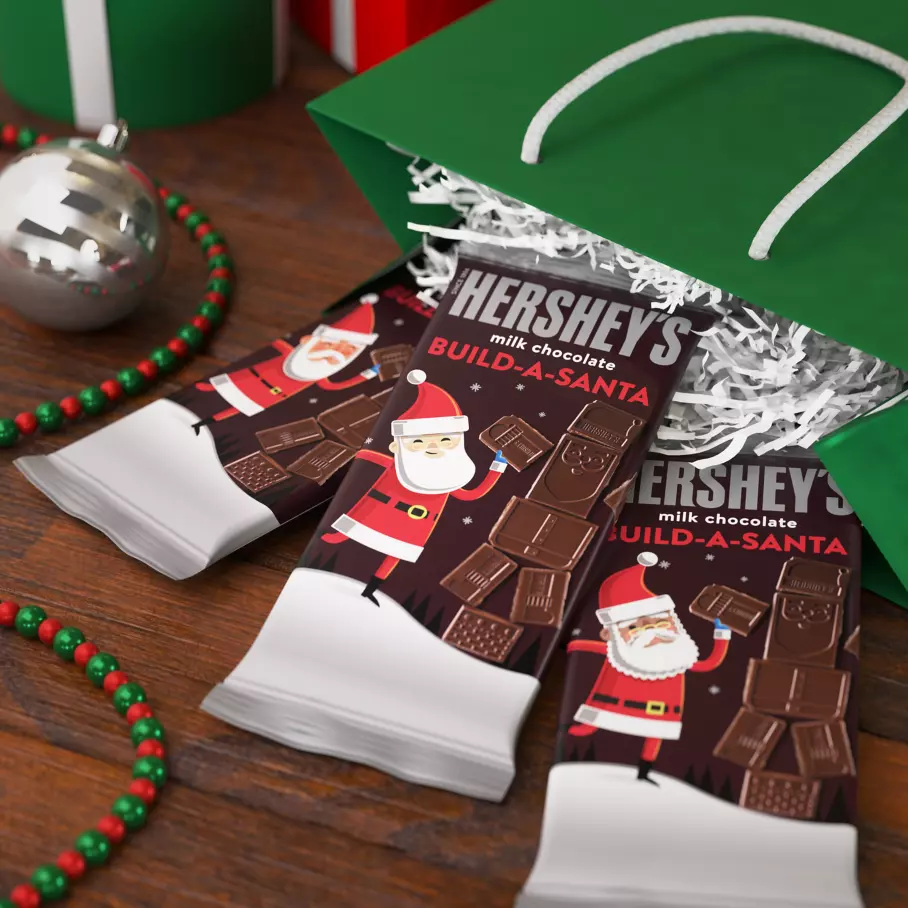 holiday shopping bag filled with hersheys build a santa milk chocolate xl candy bars