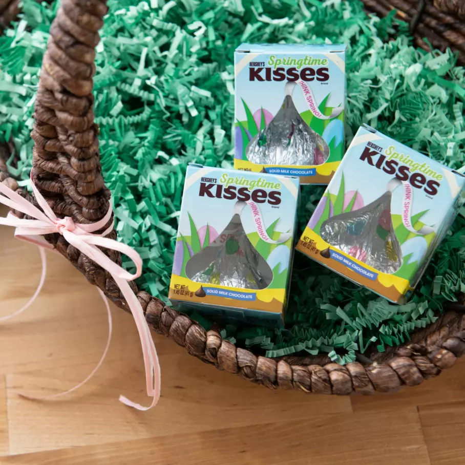 Boxes of HERSHEY'S KISSES Springtime Milk Chocolate Giant Candy inside Easter basket