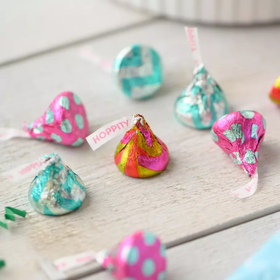 HERSHEY'S KISSES Egg Hunt Milk Chocolate Candy spread out on table