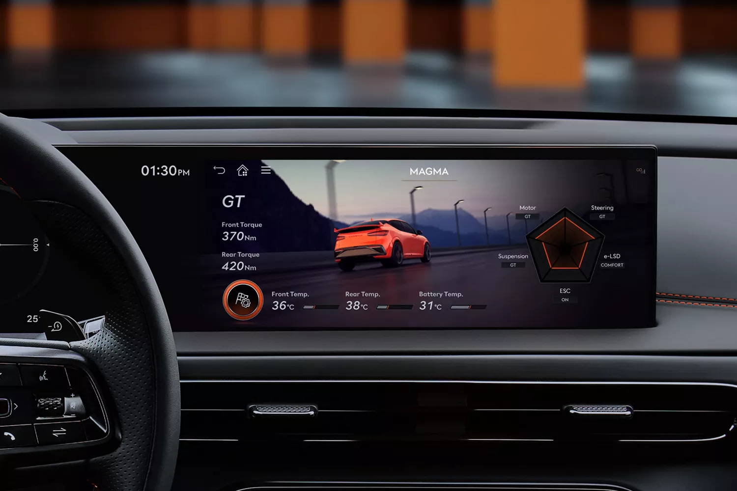 Interior close up of "GT" mode selected on infotainment screen inside 2027 Genesis GV60 Magma