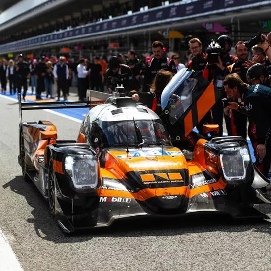 Front facing view of Genesis Magma Racing GMR-001 Hypercar stopped in pit lane at Le Mans
