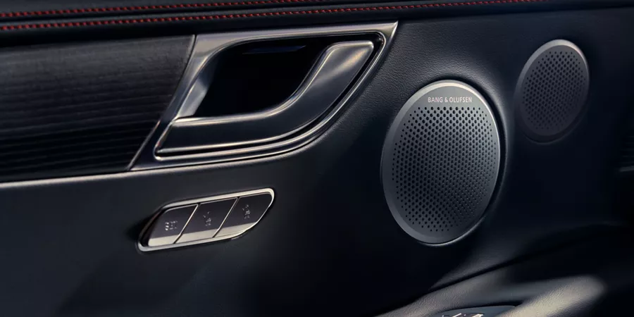 Interior closeup of Bang & Olufsen speaker inside Genesis GV80 Coupe