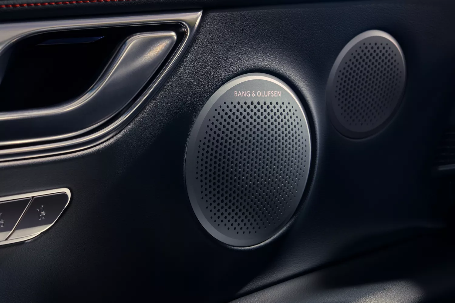 Interior closeup of Bang & Olufsen speaker inside Genesis GV80 Coupe Prestige Black