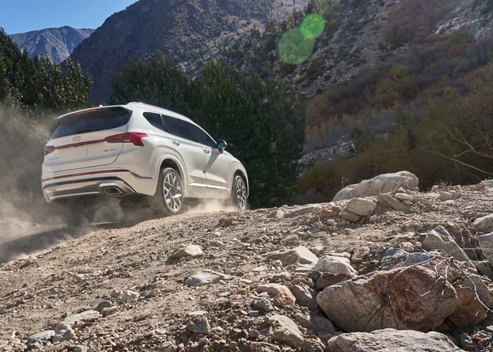 Hyundai Santa Fe climbing up a dirt road