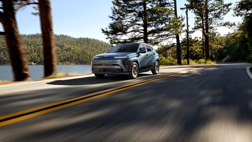 EV Car or electric power car driving down the road