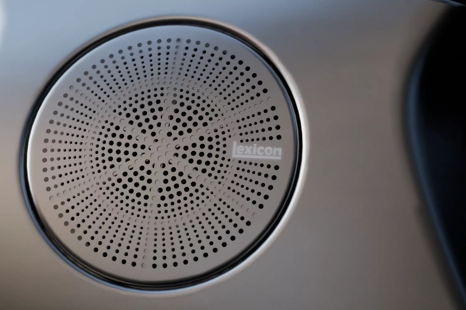 Close up interior shot of Lexicon stainless steel speaker cover in Genesis G70