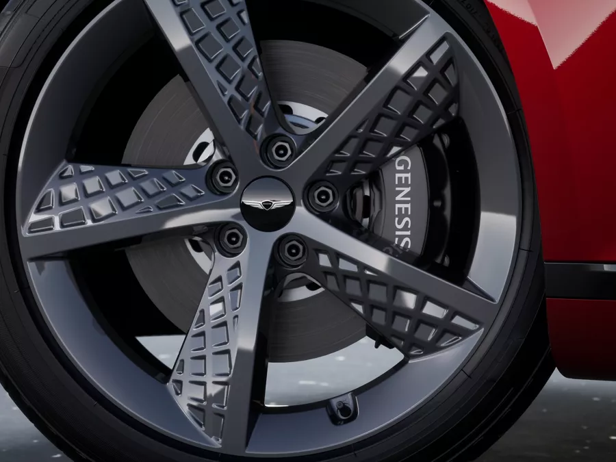Close up image of the 20-inch alloy wheel and rim on the Genesis G80 in Cavendish Red