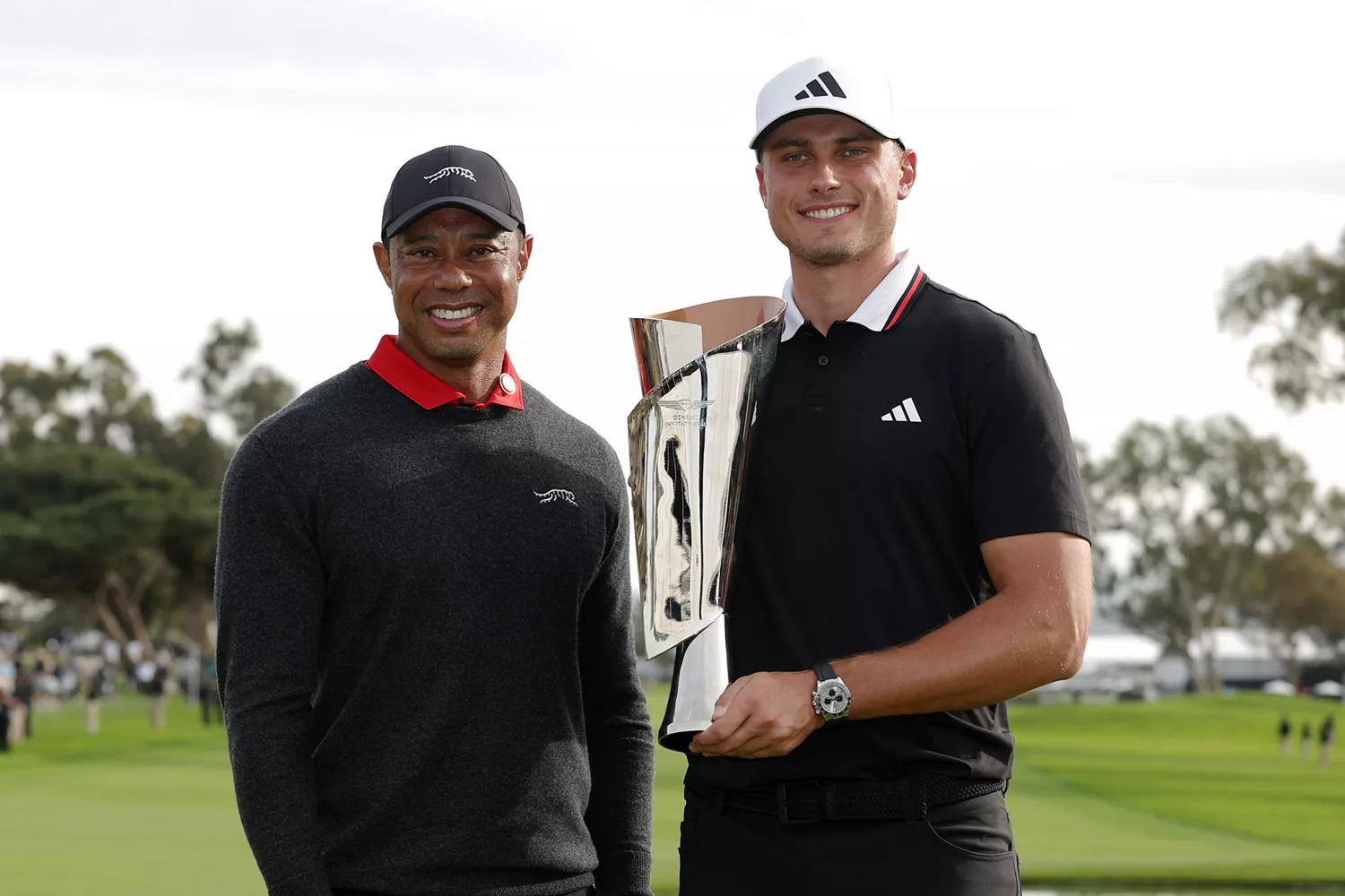 2025 Genesis Invitational Winner Ludvig Aberg pictured with Tiger Woods and the winner's trophy