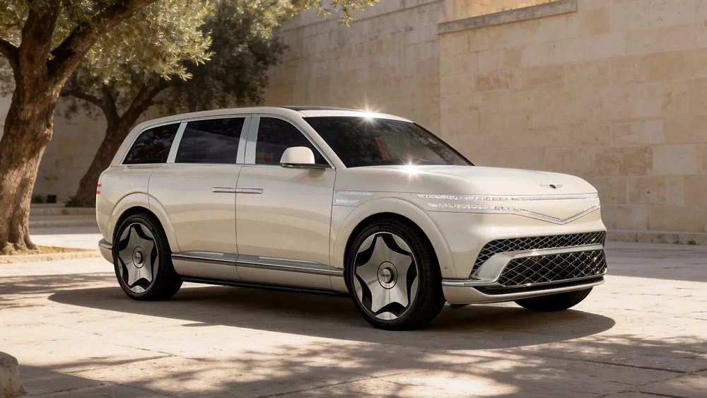 3/4 front passenger-side view of 2028 Genesis GV90 in Uyuni White in desert landscape