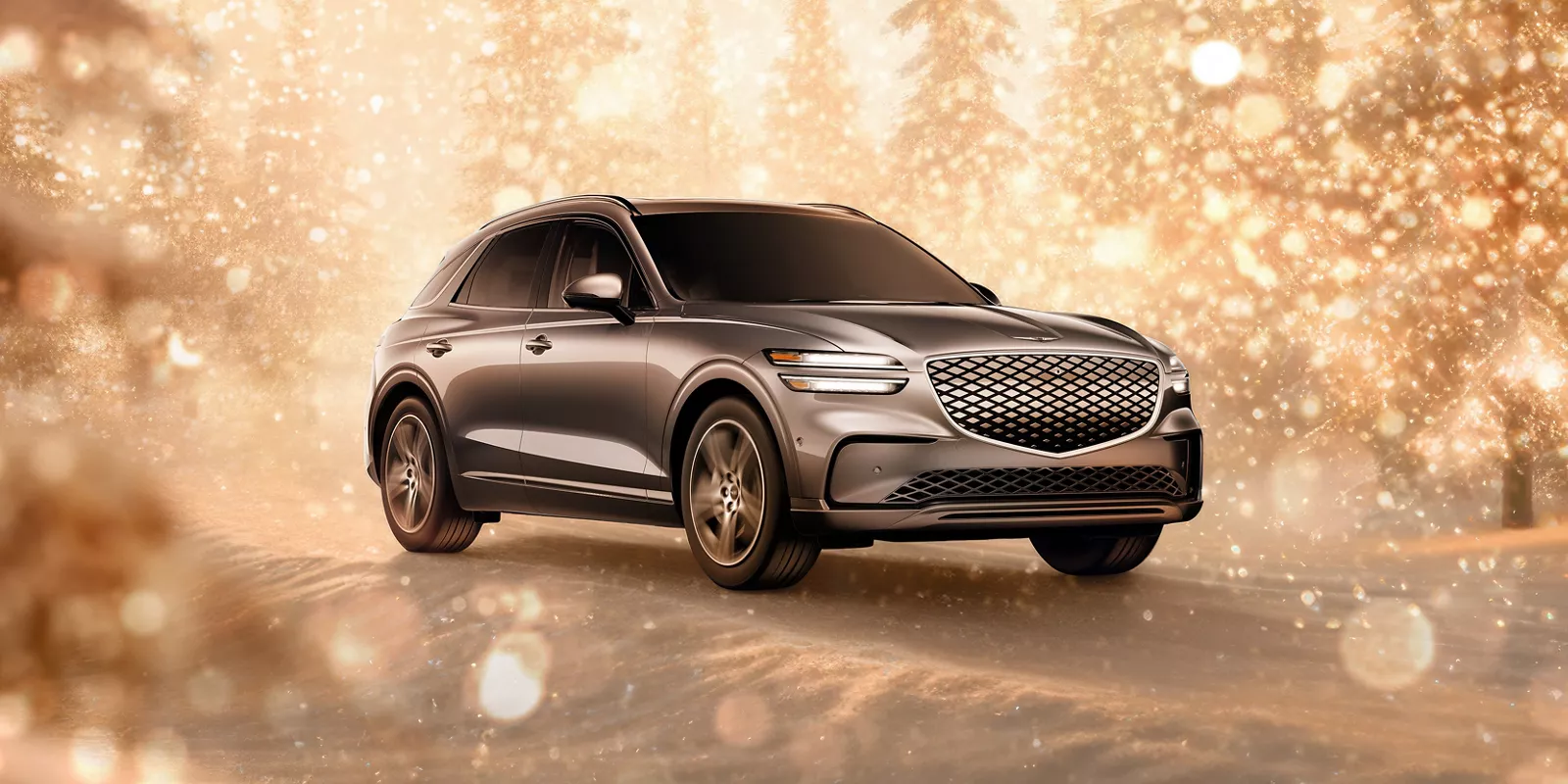 3/4 front passenger side view of Electrified Genesis GV70 parked in snowy gold sparkling environment