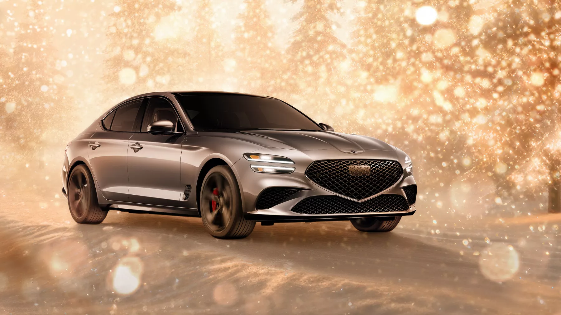 3/4 front passenger side view of gray 2026 Genesis G70 parked in snowy, gold sparkling environment