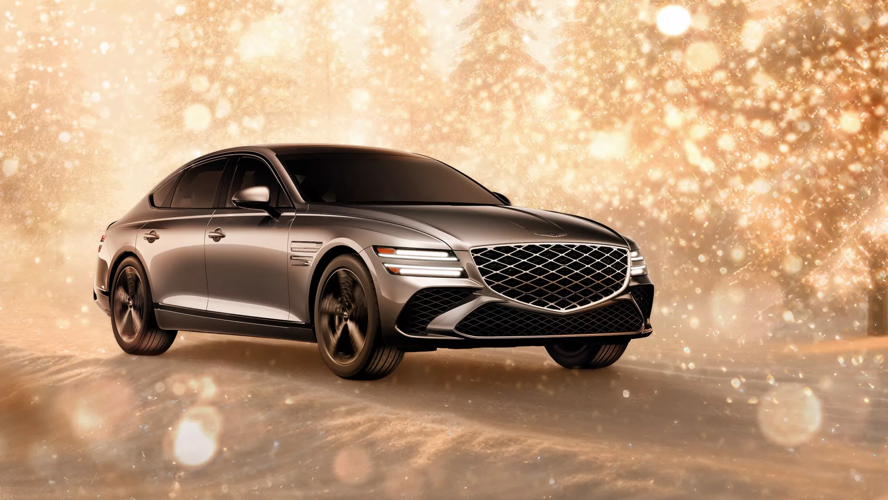 3/4 front passenger side view of gray 2025 Genesis G80 parked in snowy, gold sparkling environment