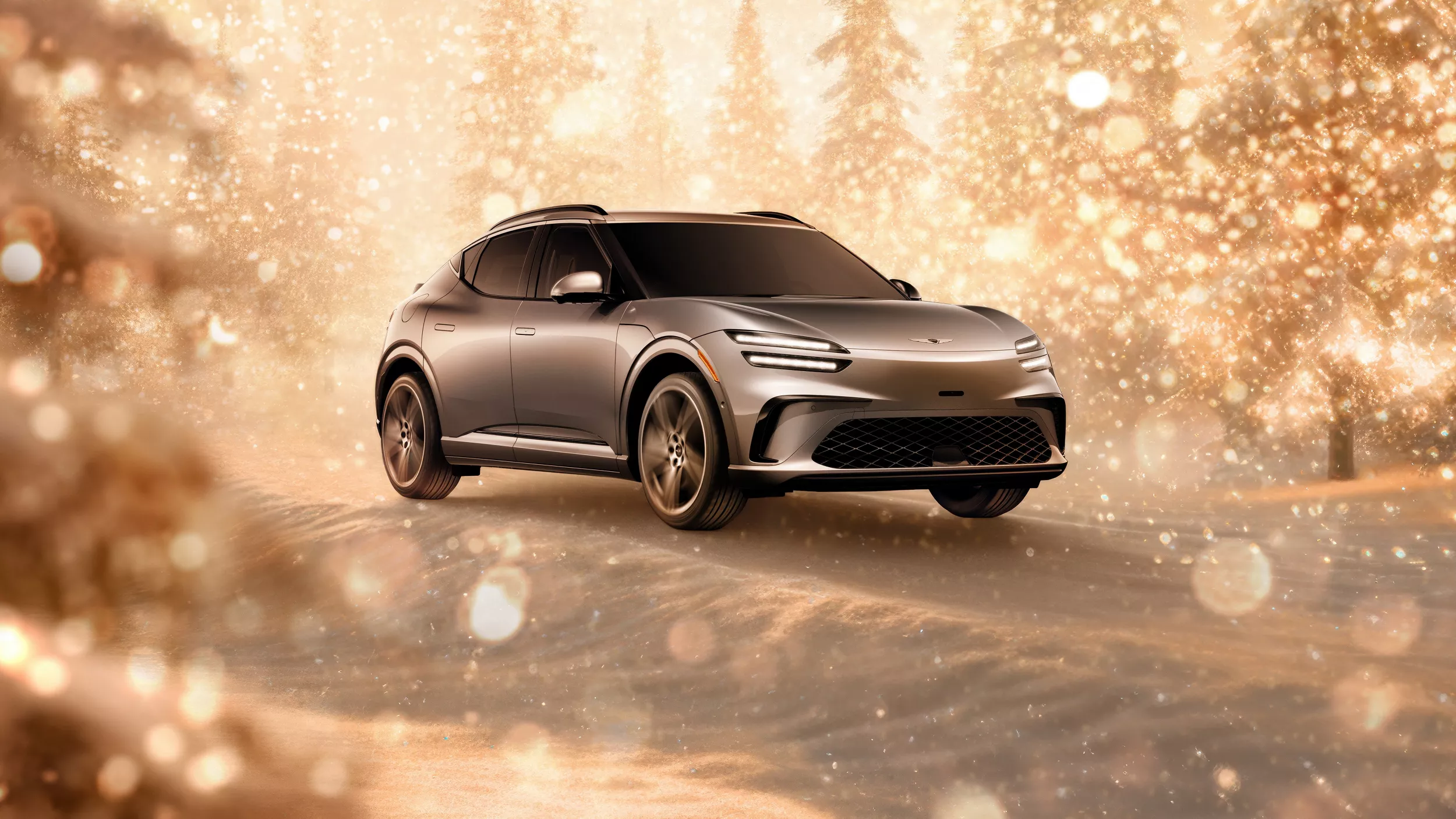 3/4 front passenger side view of gray 2026 Genesis GV60 parked in snowy, gold sparkling environment