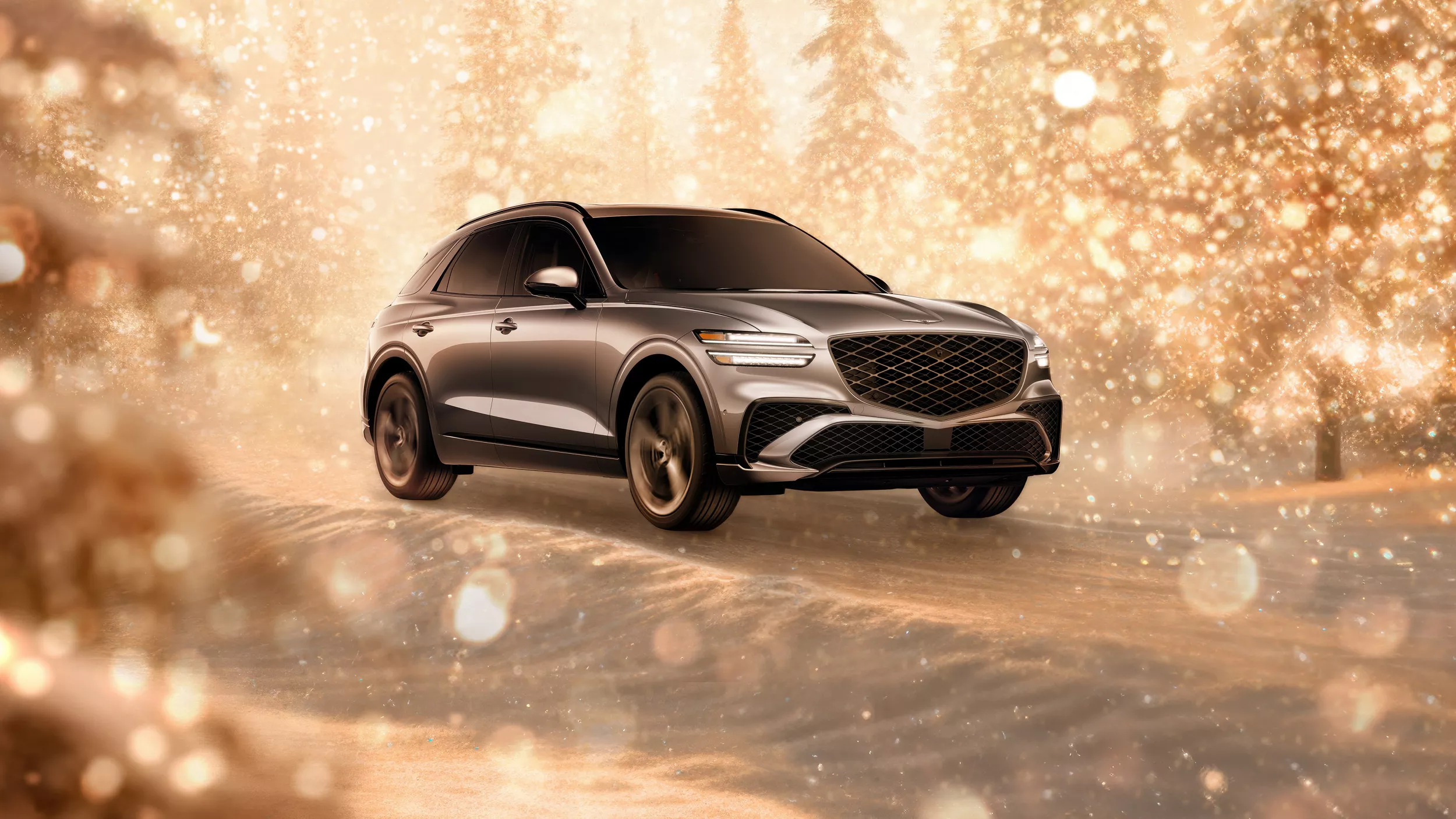 3/4 front passenger side view of gray 2026 Genesis GV70 parked in snowy, gold sparkling environment