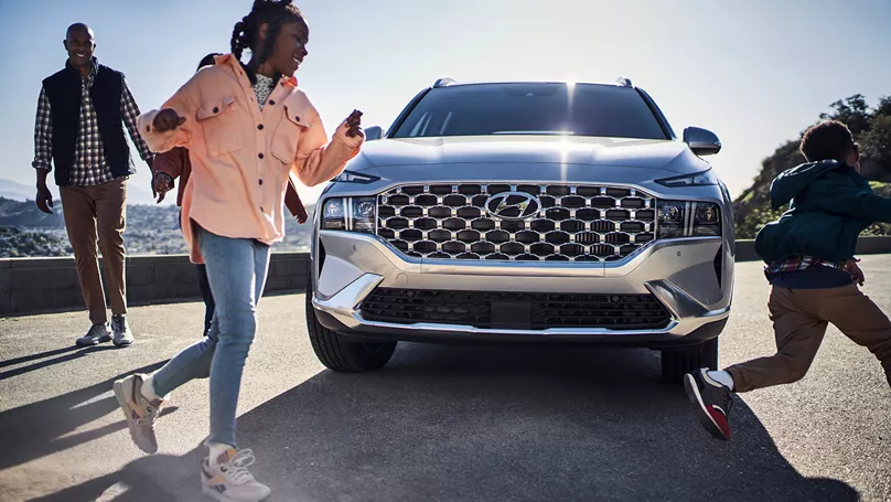 A woman shops online for a Sonata using Hyundai Shopper Assurance.