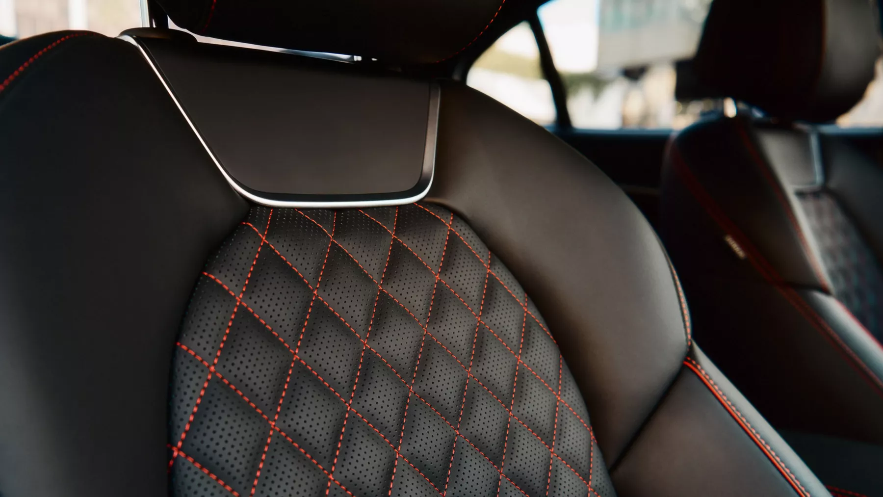Black G70 front seats with red diamond stitching. 