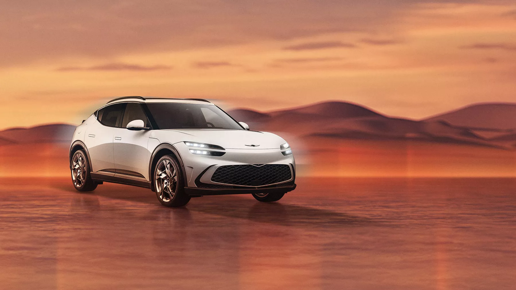 Genesis GV60 in Alta White on desert background