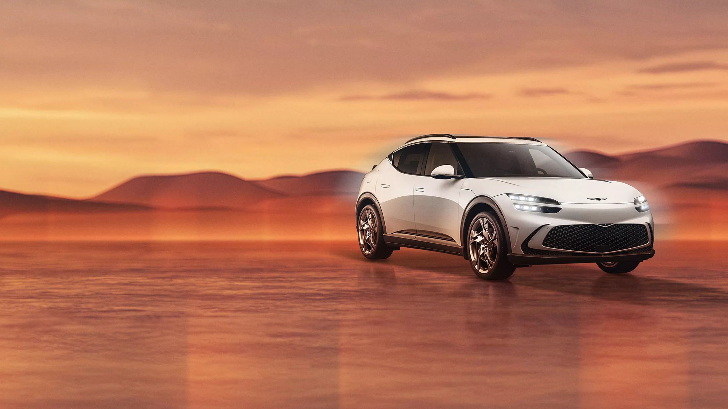 Genesis GV60 in Alta White on desert background