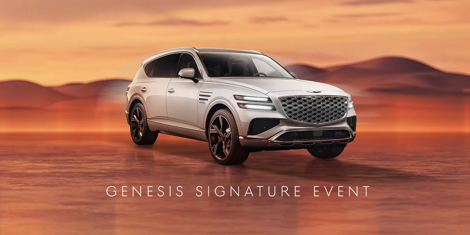 Genesis GV80 in Uyuni White on desert background; 'Genesis Signature Event' text at the bottom