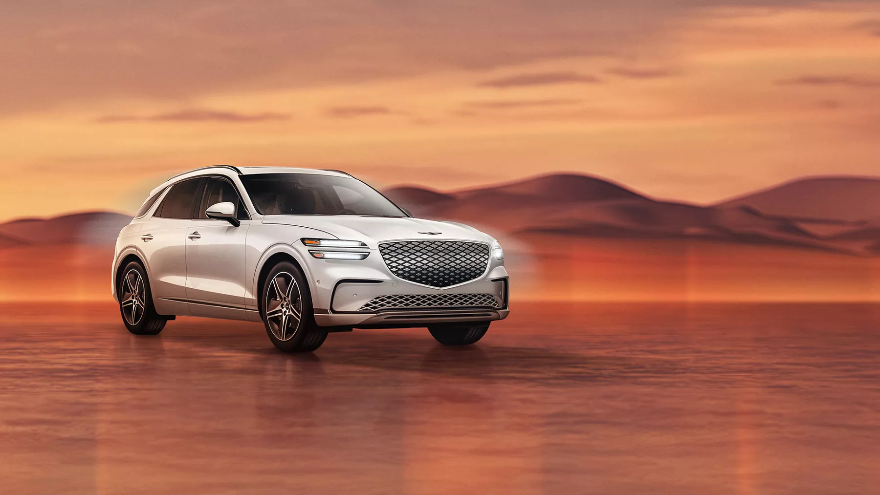 Genesis Electrified GV70 in Alta White on desert background