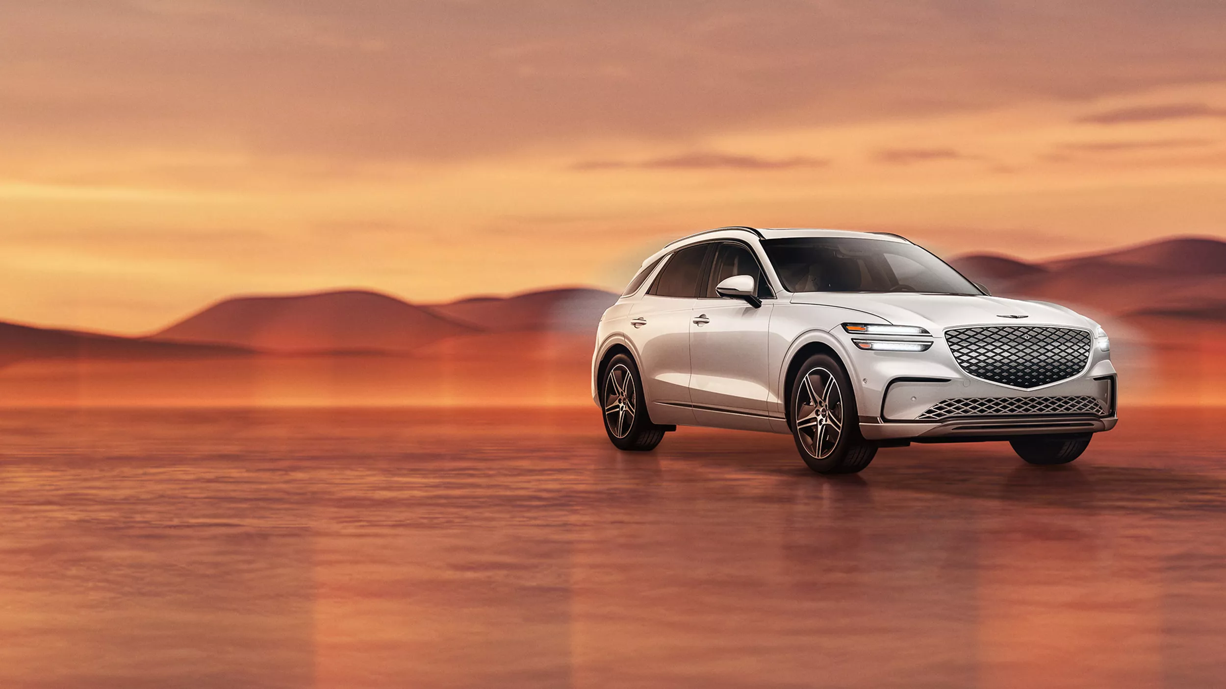Genesis Electrified GV70 in Alta White on desert background