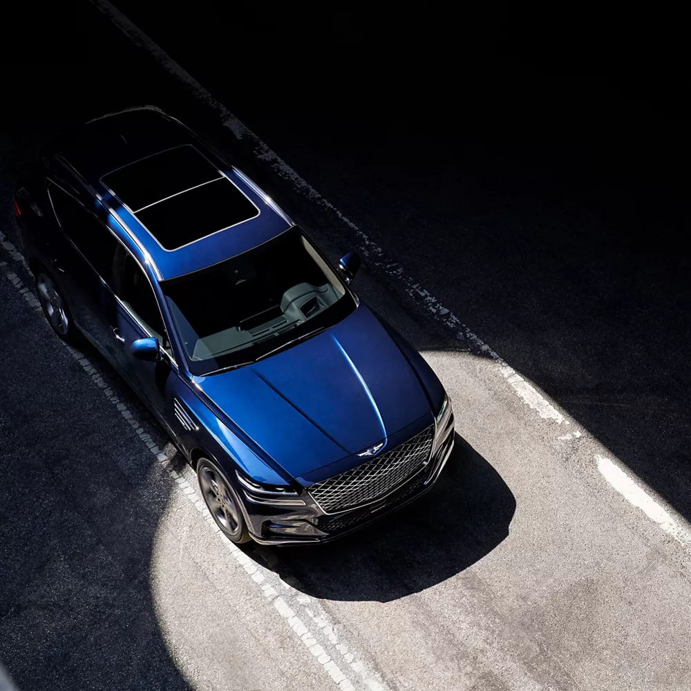 Top-down view of a blue GV80 with a sunroof.