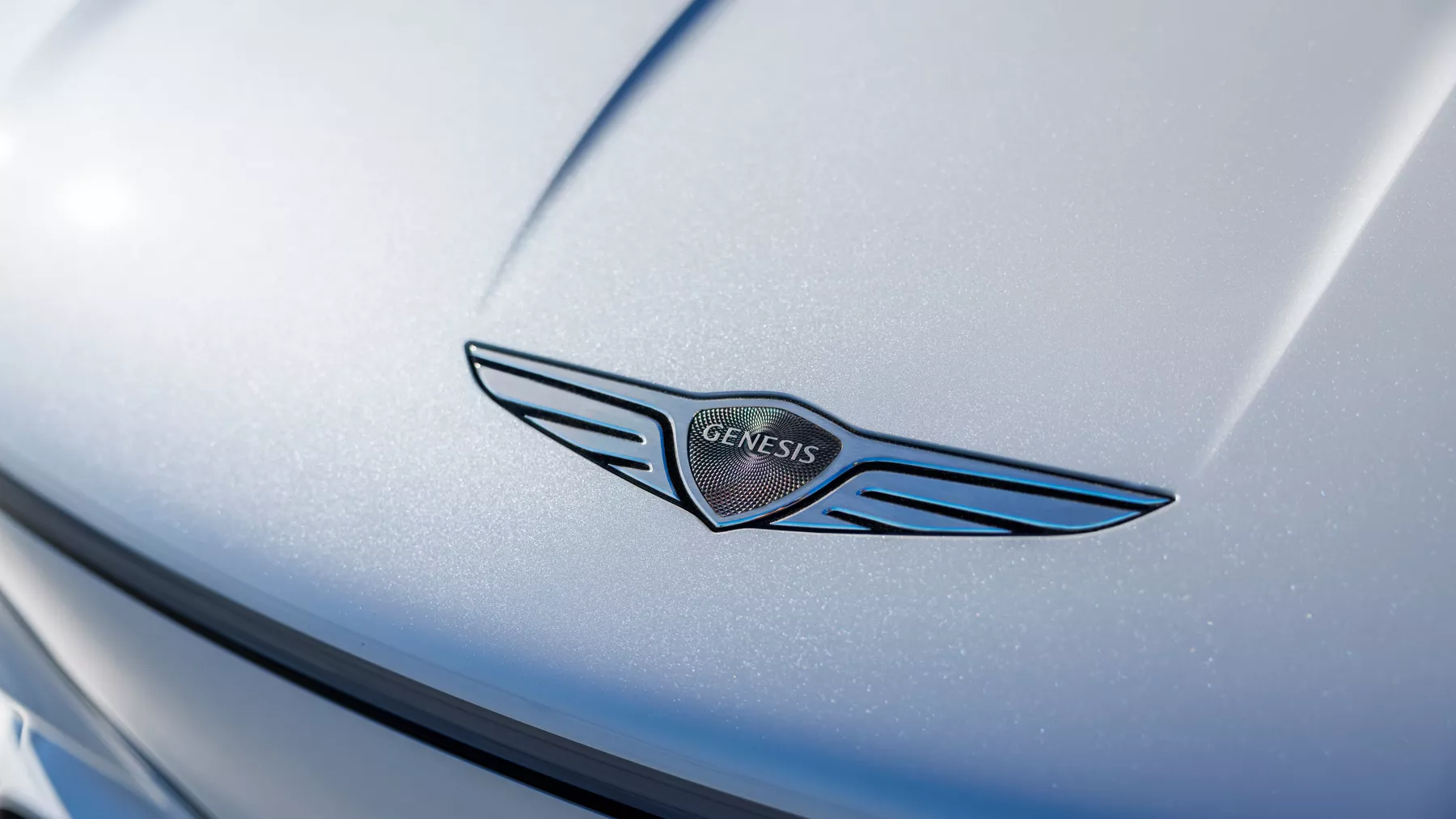 Close-up of the Genesis emblem on the hood of the X Convertible Concept.
