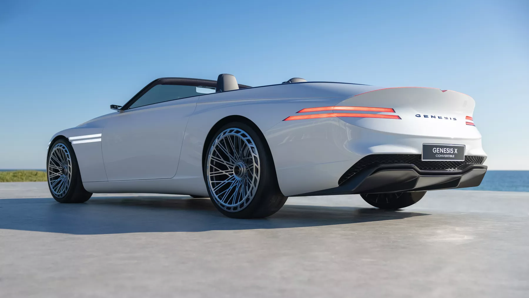 Rear view of a parked X Convertible Concept with a blue sky overhead.