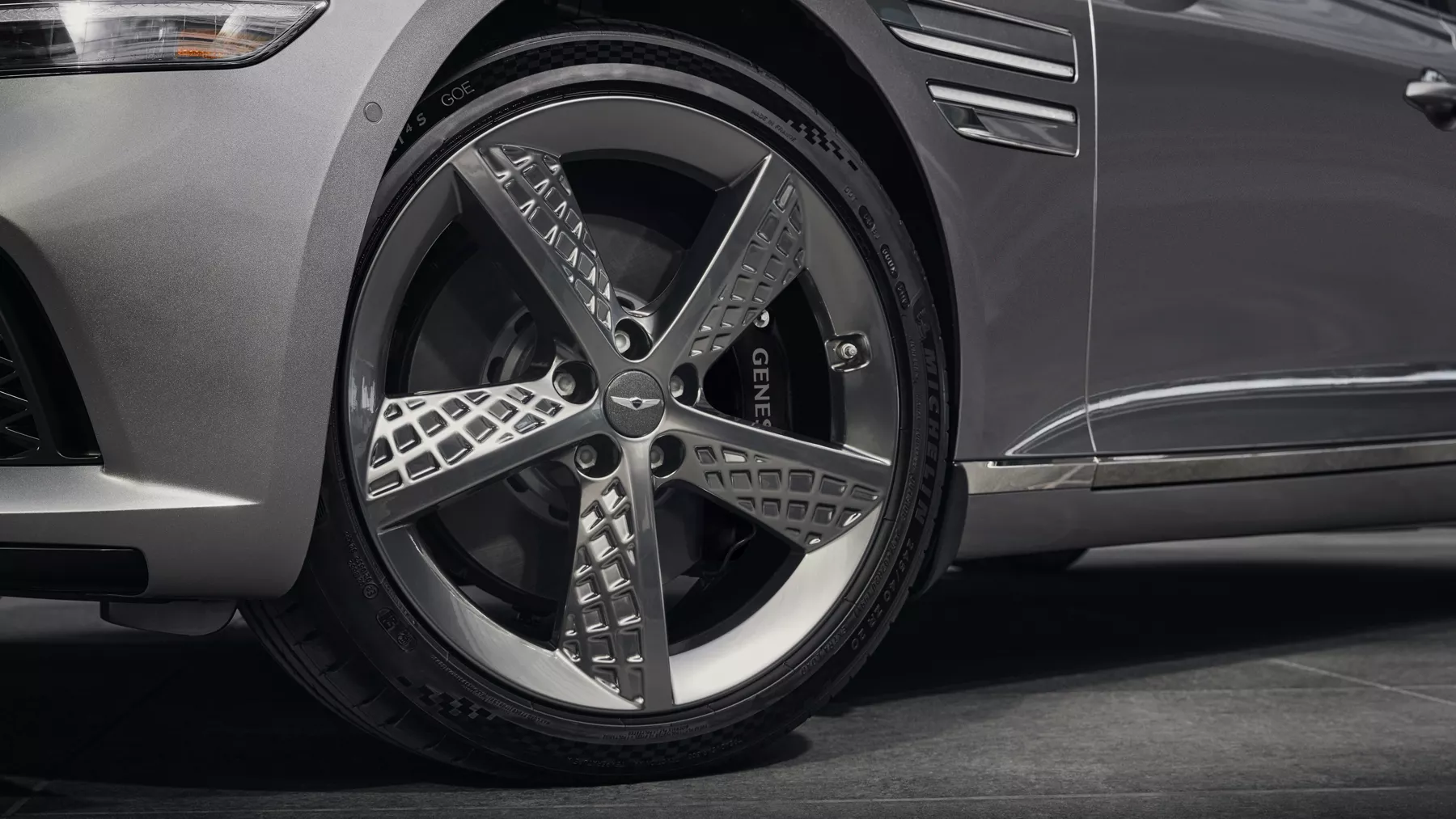 G80 front tire with twenty inch sport alloy wheels.