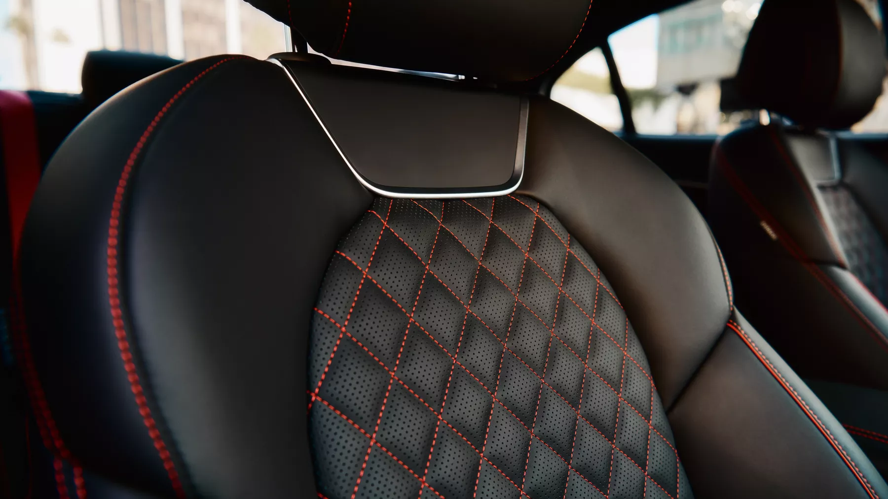 Black G70 front seat with red diamond stitching. 