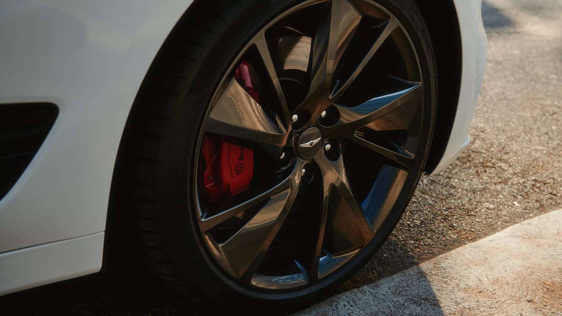 G70 front tire parked at a curb.