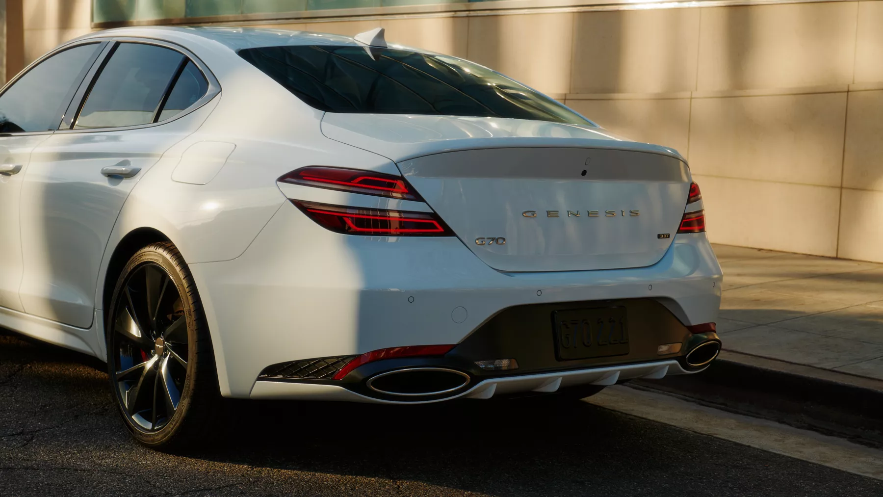 Rear view of G70 back tires and trunk.