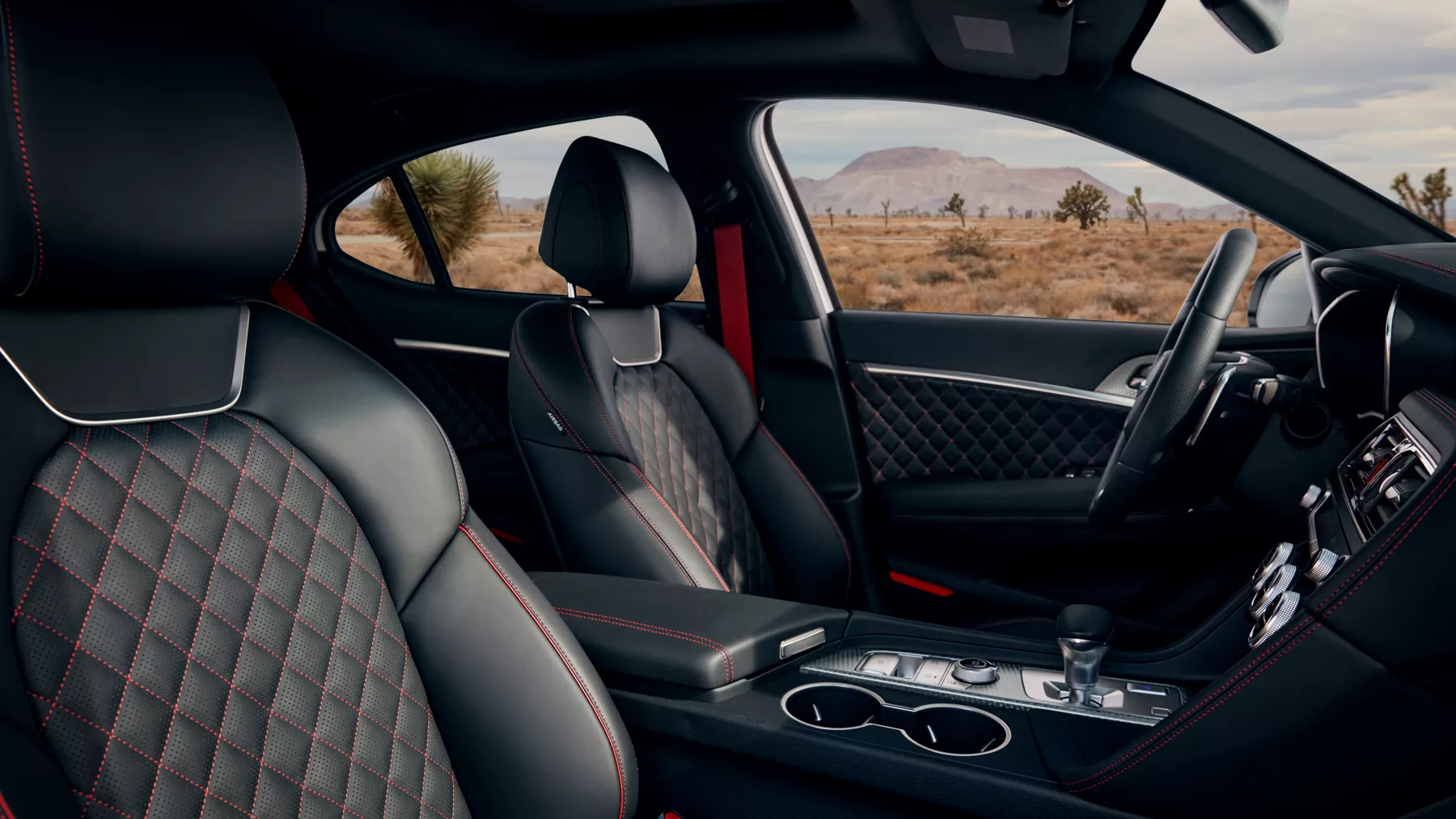 Black G70 front seats with red diamond stitching. 