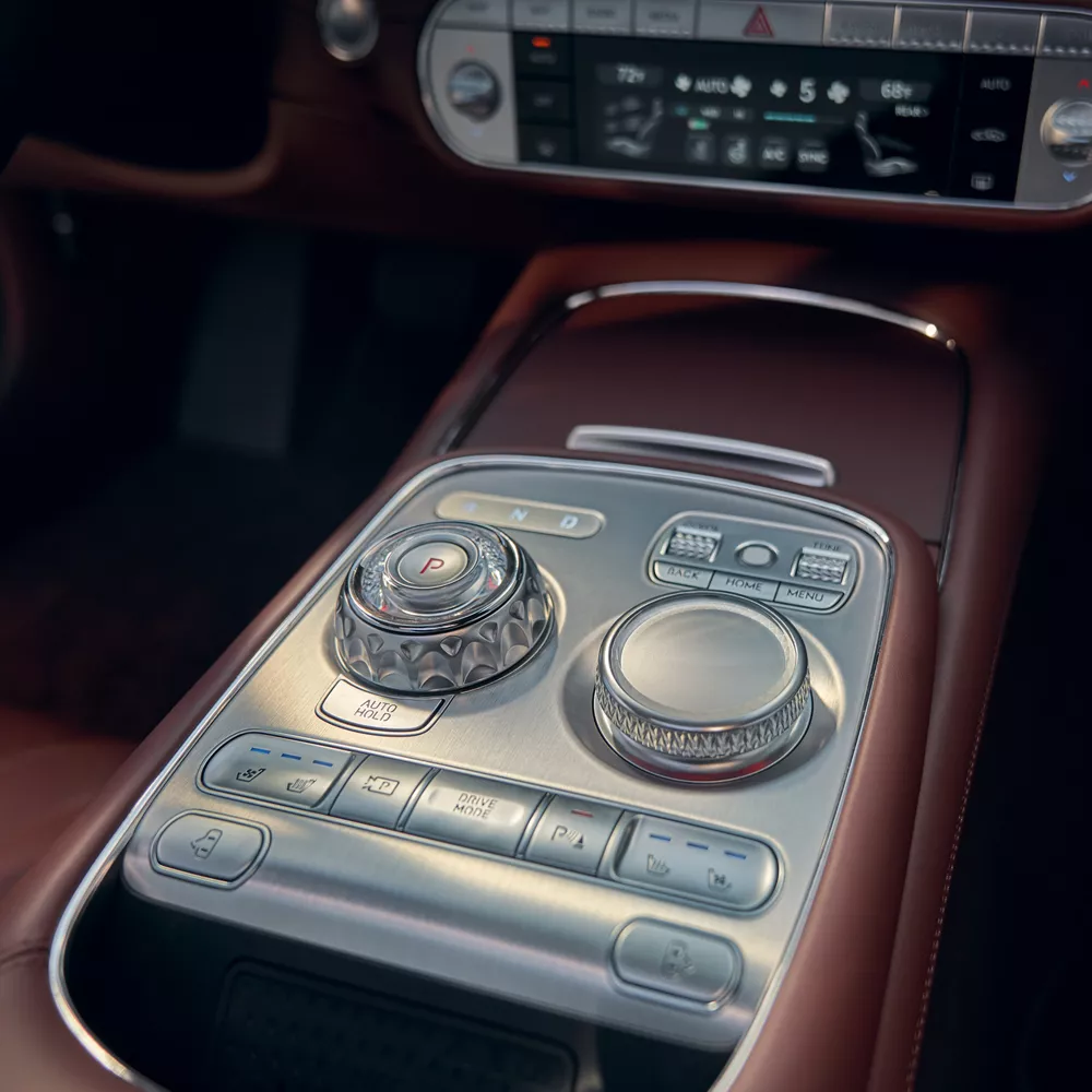Interior closeup of the center console in Bordeaux Brown inside the 2026 Genesis G90