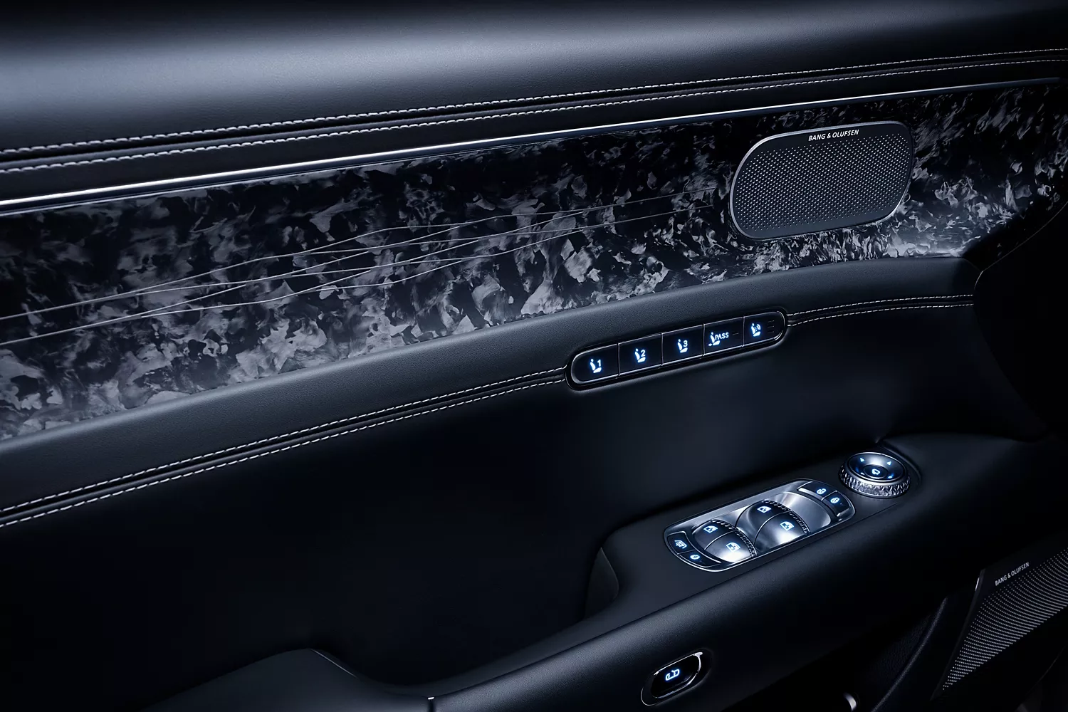 Close up of black driver side door panel inside 2026 Genesis G90
