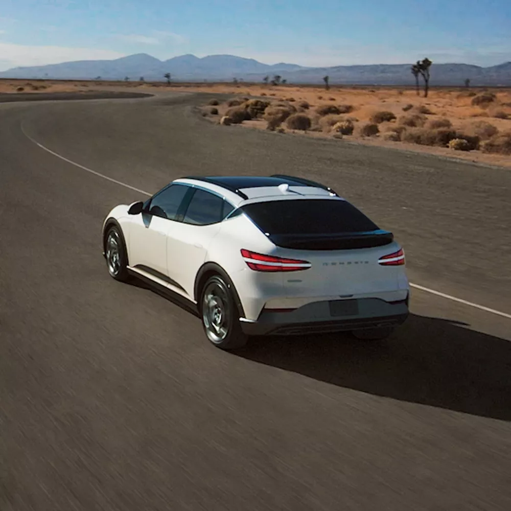 GV60 driving on a desert highway. 