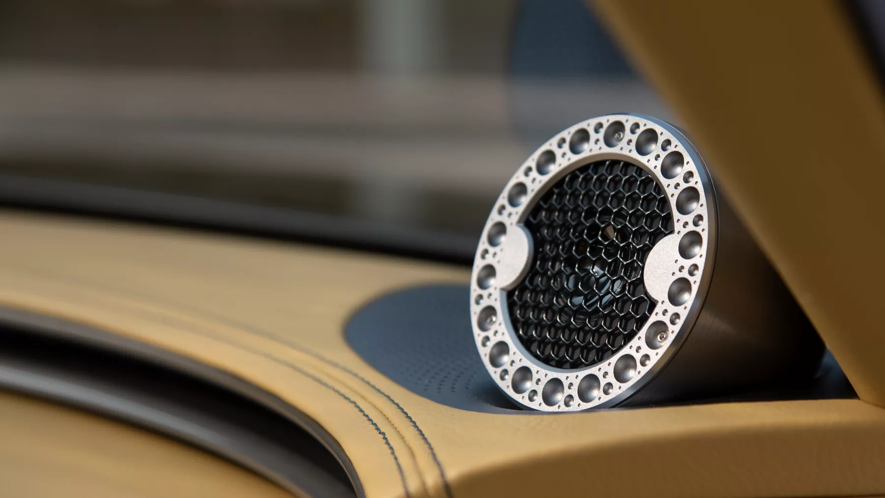 Close-up view of X Speedium Coupe Concept speaker.