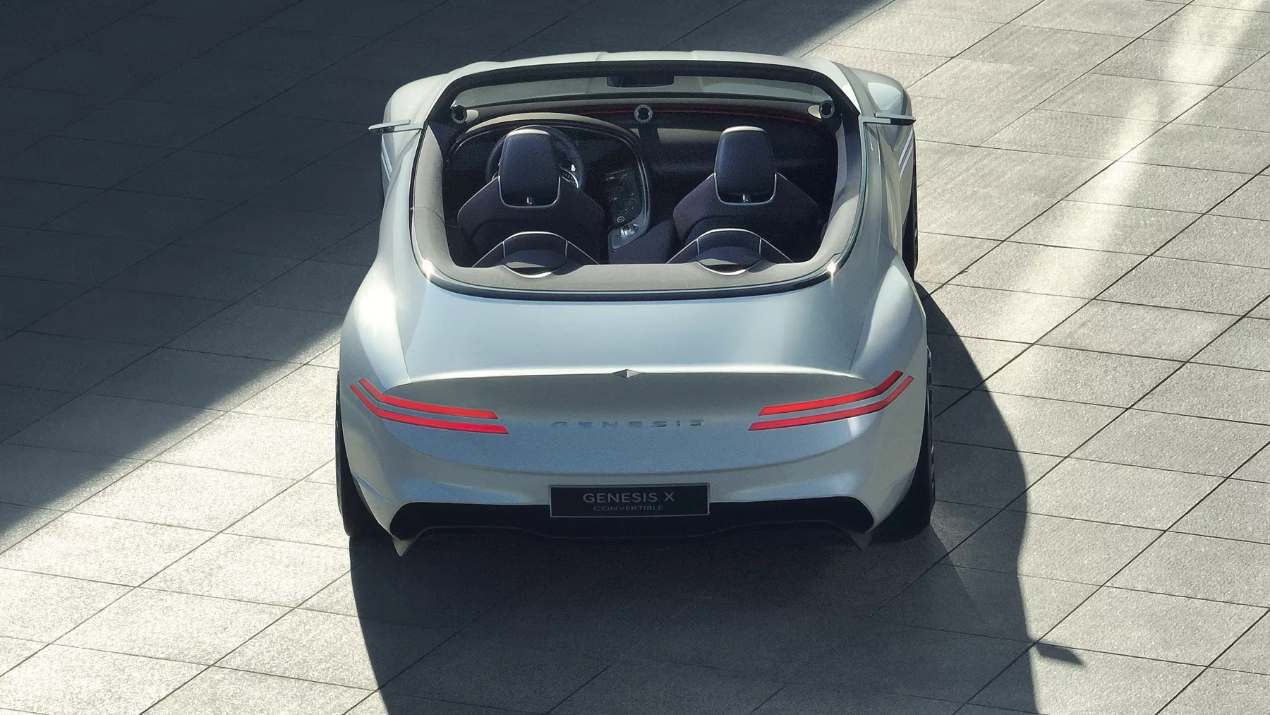 Rear view of X Convertible Concept with taillight illuminated.
