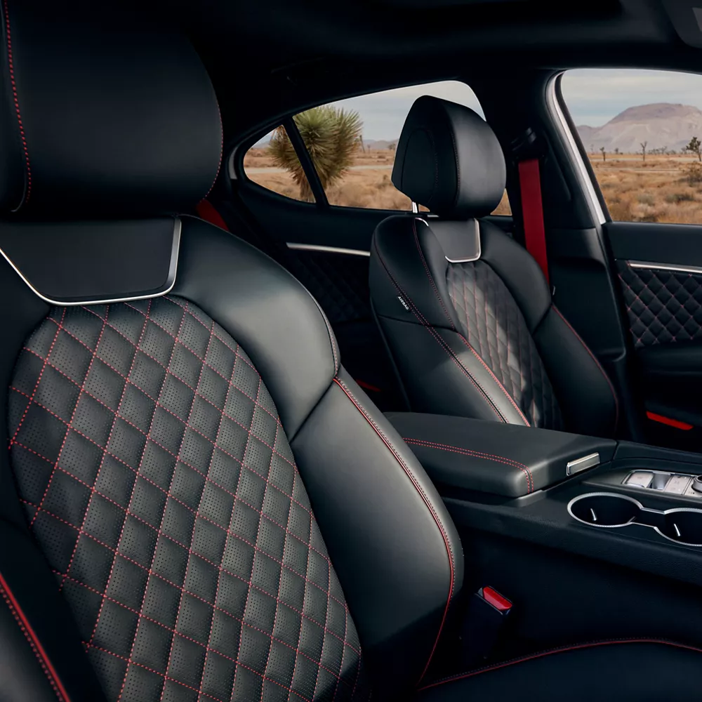 Black G70 front seats with red diamond stitching. 