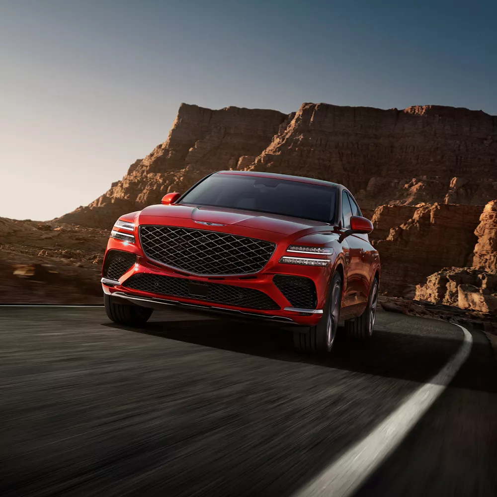 Action shot of the GV80 Coupe on a desert road.