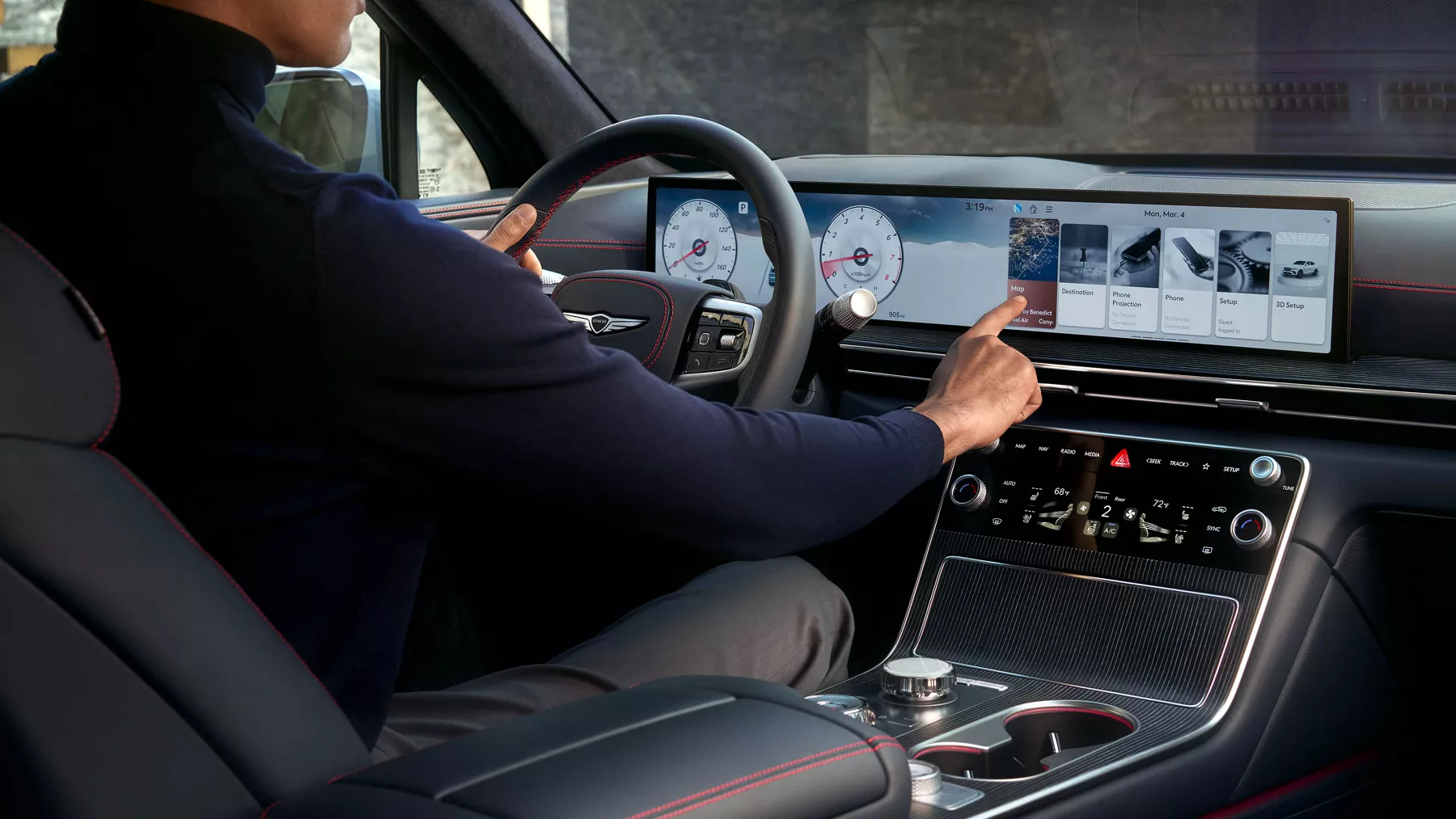 Man using the touchpad to control the infotainment system.