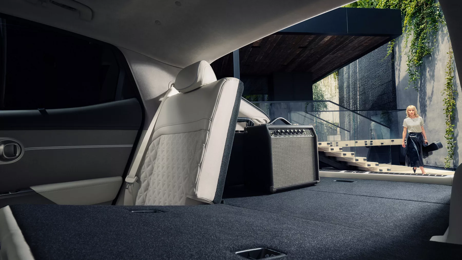 GV60 back seat folded down to show storage space.