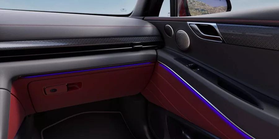 GV80 Coupe interior showcasing ambient lighting on the doors.
