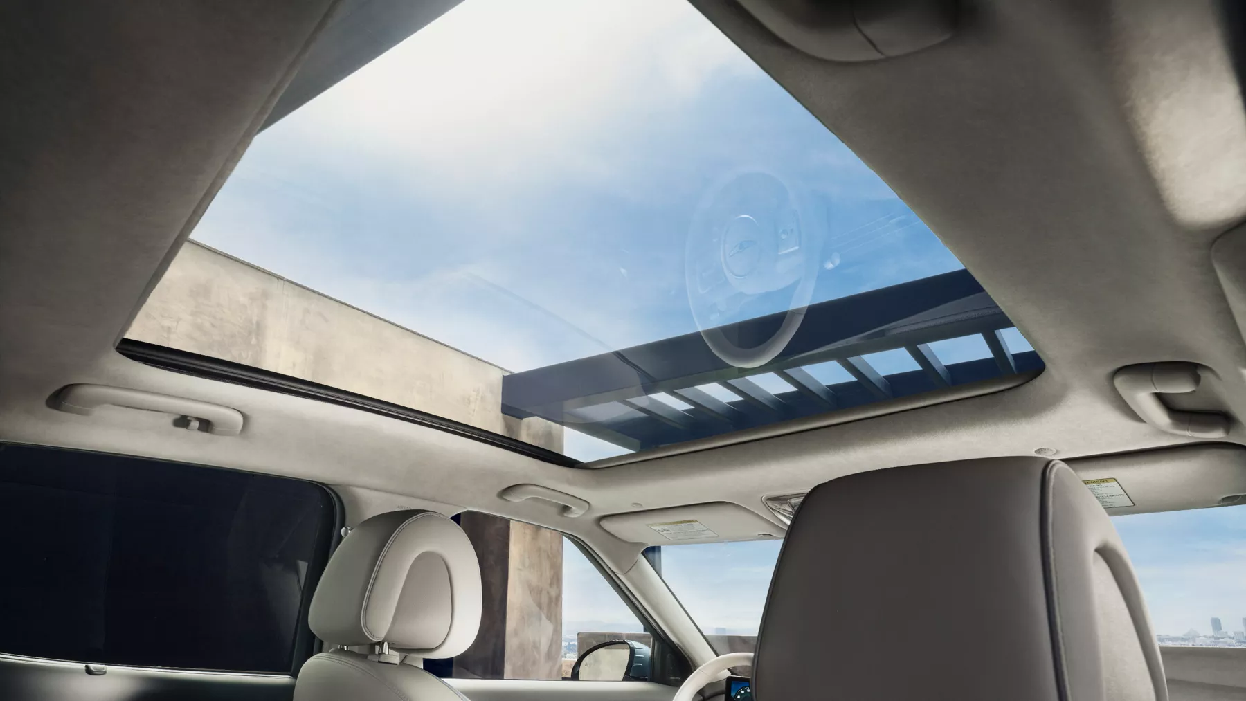 GV60 vision roof with sunlight streaming in.