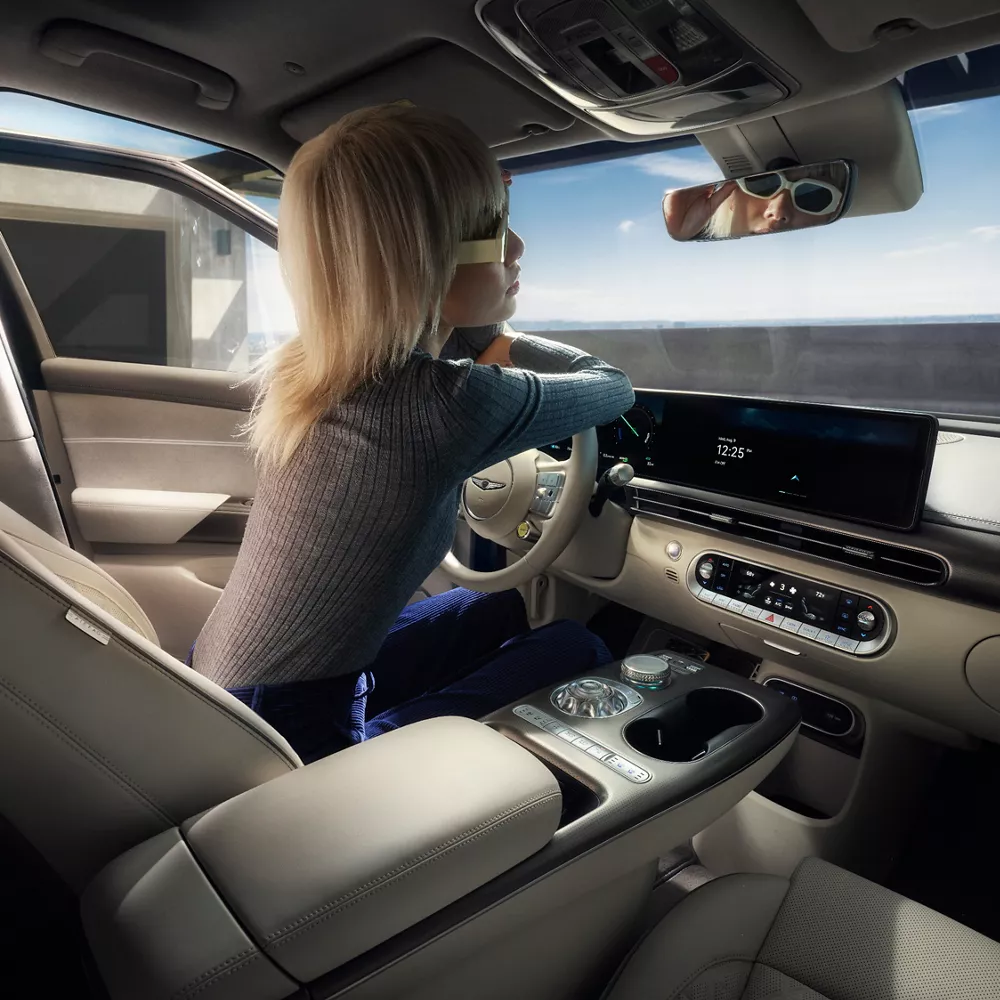 A child sitting in the front seat of the GV60.