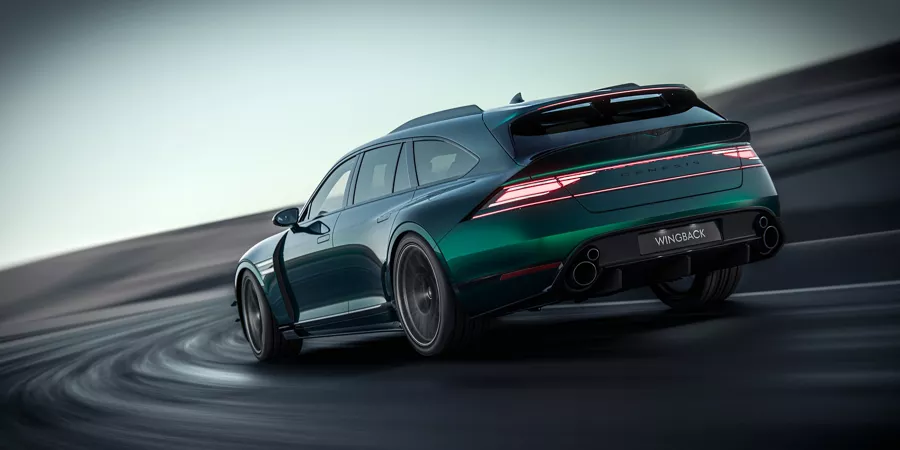 3/4 rear driver side view of Genesis G90 Wingback Concept in green driving on a racetrack