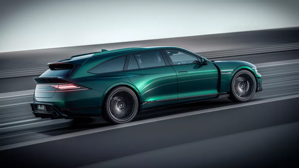 Rear 7/8 passenger side view of green Genesis G90 Wingback Concept in motion on a track