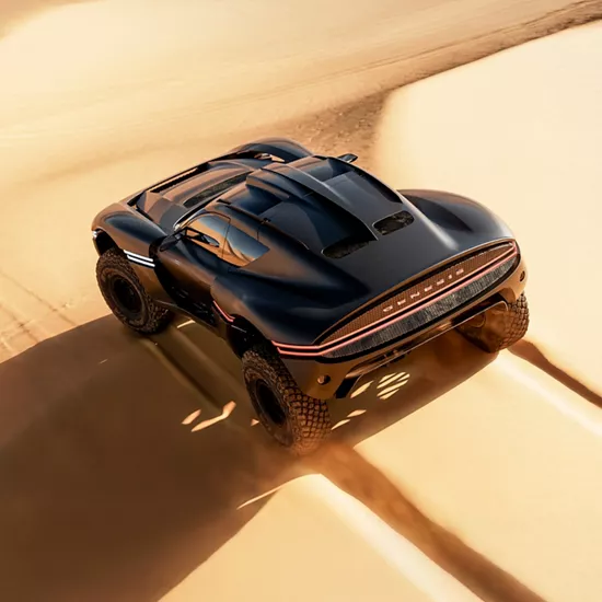 Rear overhead shot of Genesis X Skorpio Concept driving through desert sands