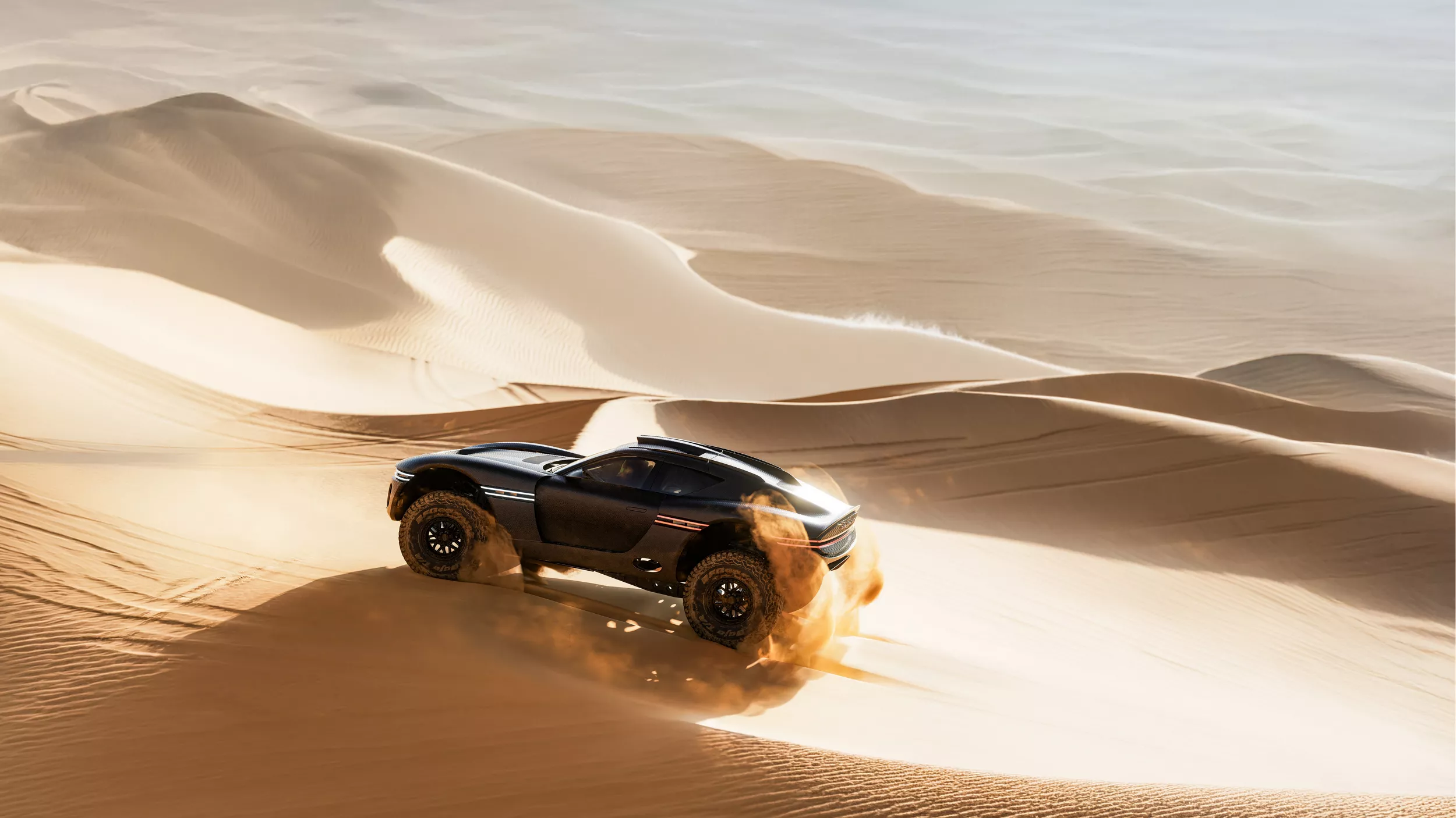 Genesis X Skorpio Concept driving across desert dunes, sand spraying as off-road coupe speeds ahead